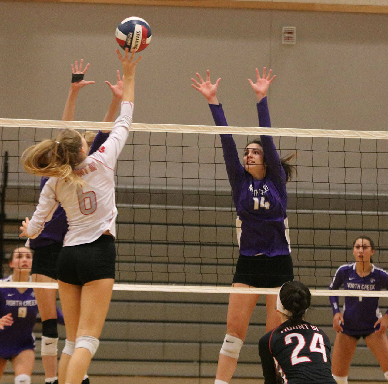 North Creek’s Sofia DeCoteau (right) goes up for a block against Mount Si’s Breana Fitzgerald. Andy Nystrom/ staff photo