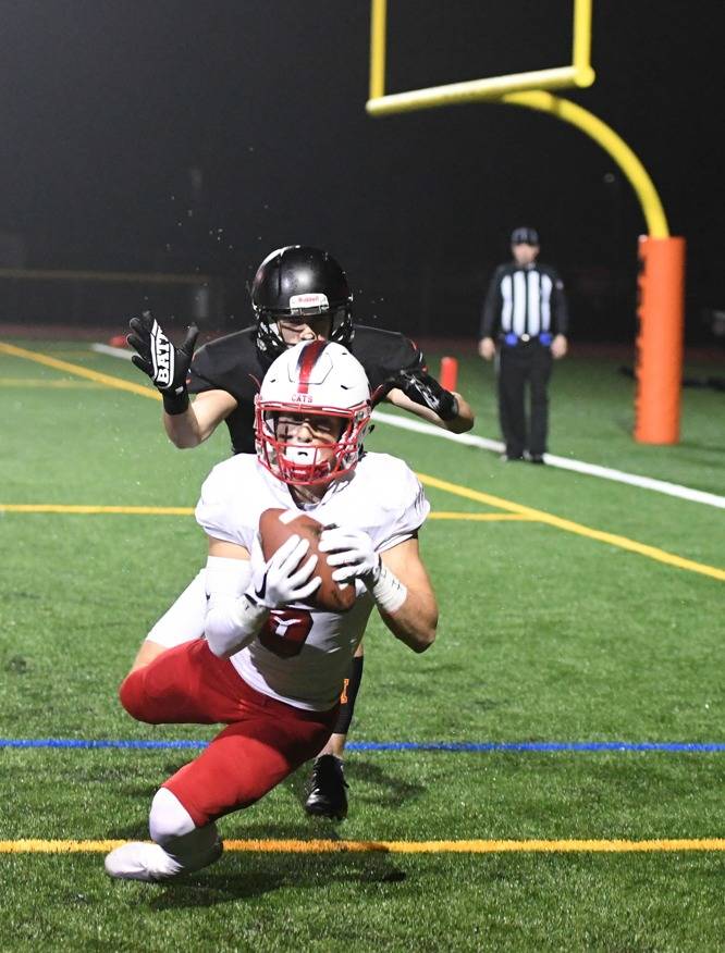Mount Si’s Brayden Holt snags a touchdown catch in the first quarter against Monroe. Photo courtesy of Calder Productions