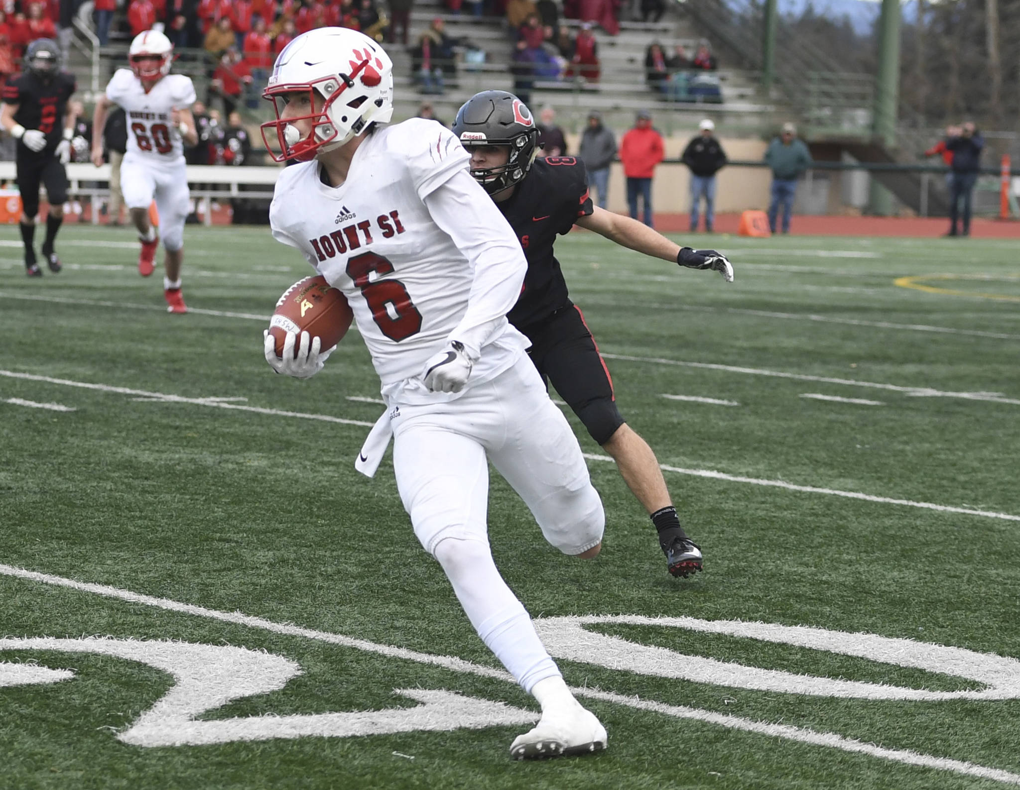 Mount Si wide receiver Brayden Holt runs for a touchdown against Camas in a 4A state semifinal on Nov. 30. Photo courtesy of Calder Productions