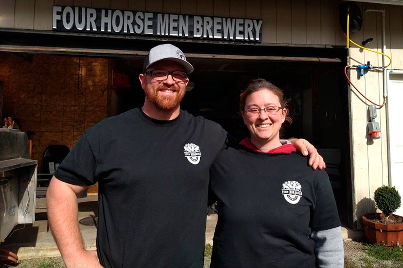Dane Scarimbolo and Dominique Torgerson, shown in this October 2019 file photo, run Four Horsemen Brewery in Kent. They were almost shut down in late 2017 by King County, which after years of letting them operate a brewery and taproom, decided they were in violation of county code. (Aaron Kunkler/Sound Publishing)