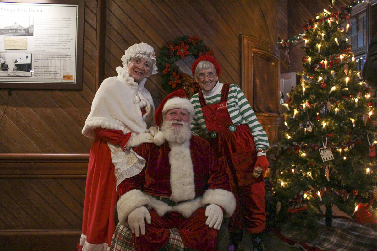 Mrs. Claus, Zoe the oldest Elf, and Santa Claus at the Northwest Railway Museum’s Snoqualmie Depot during their 50th annual Santa Train event. Natalie DeFord/staff photo