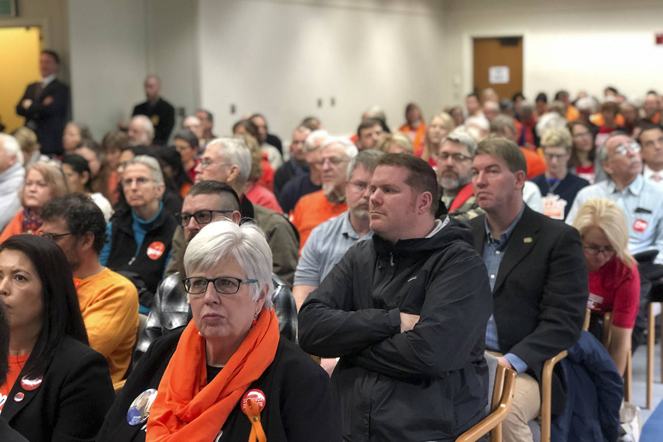 Photo by Leona Vaughn / WNPA News Service                                Washington residents at a Senate Law and Justice Committee hearing on a proposed ban on high capacity gun magazines this week. Many wore orange in support of gun safety.