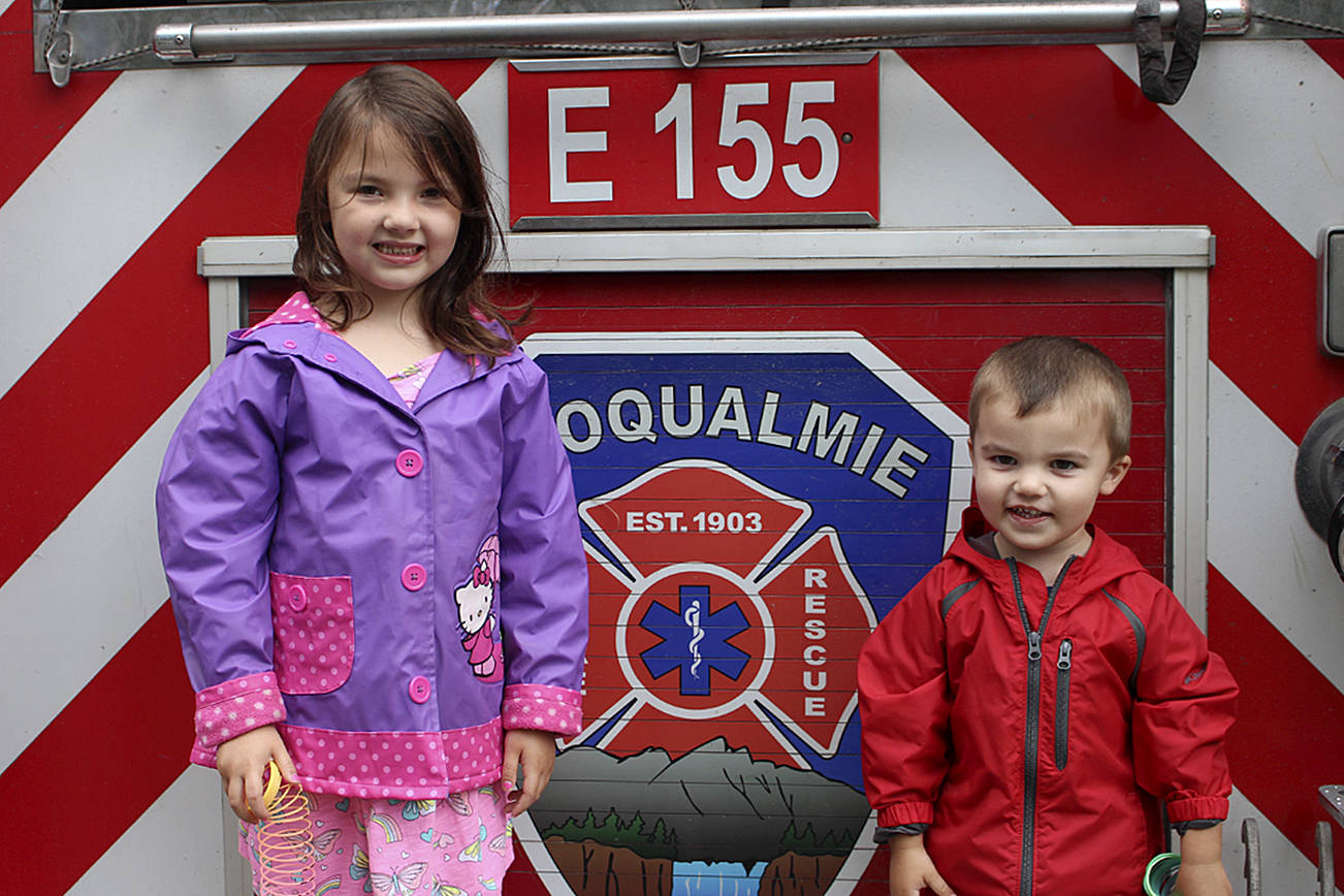 6-year-old Finley Gendron (left) and her little brother, Boston Gendron, explore the city’s fire truck during Big Truck Day in 2019. File photo