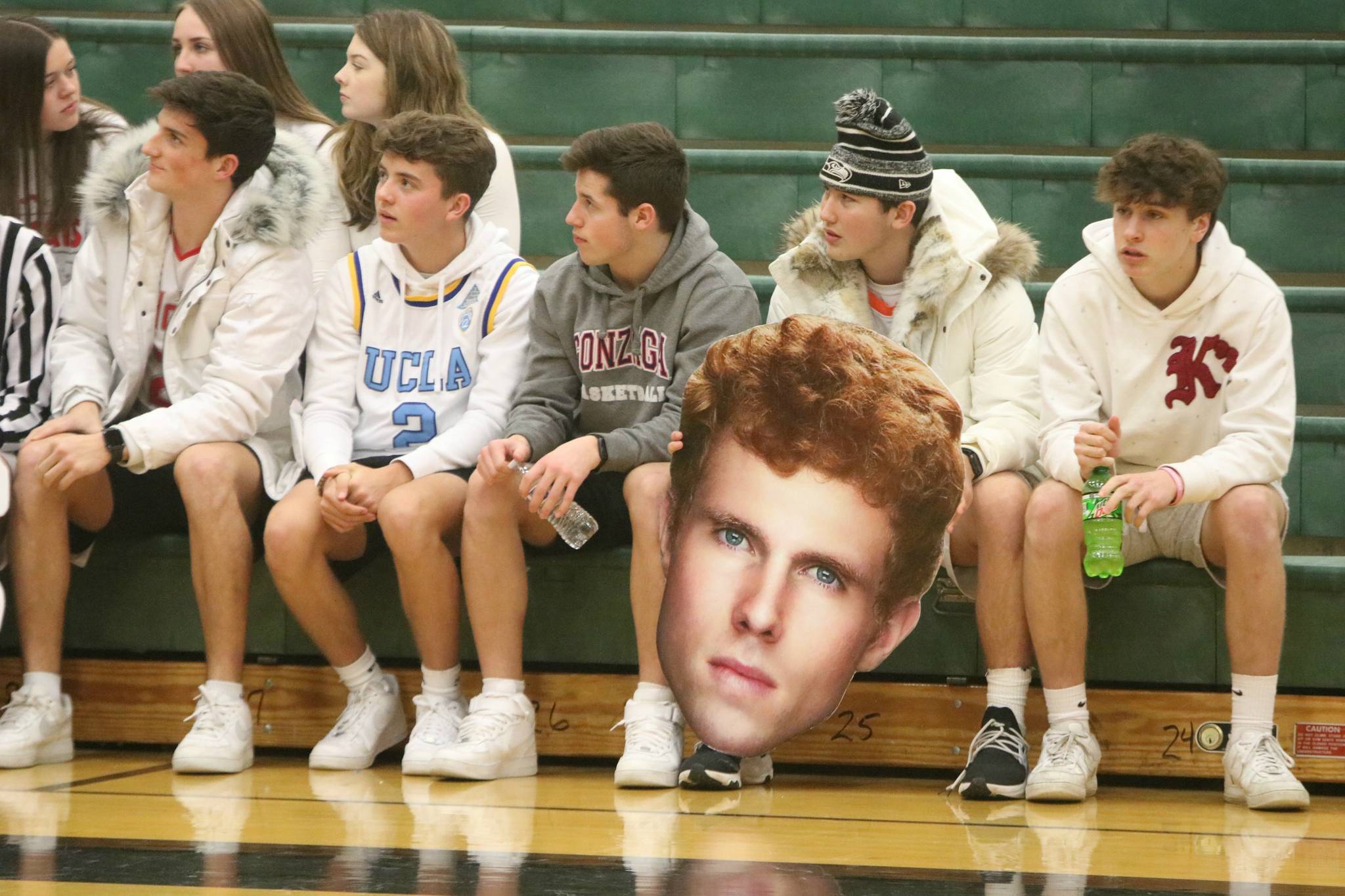 Fans display a Jabe Mullins cardboard cutout at a recent game. Andy Nystrom/ staff photo