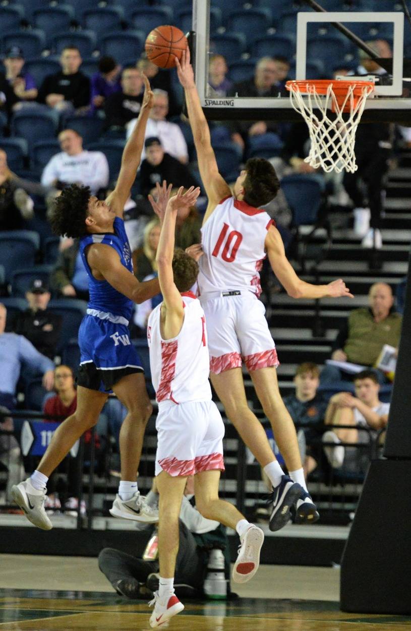 Mount Si’s Hayden Curtiss thumps a block against Federal Way in the Wildcats’ quarterfinal victory at the Tacoma Dome. Photo courtesy of Calder Productions