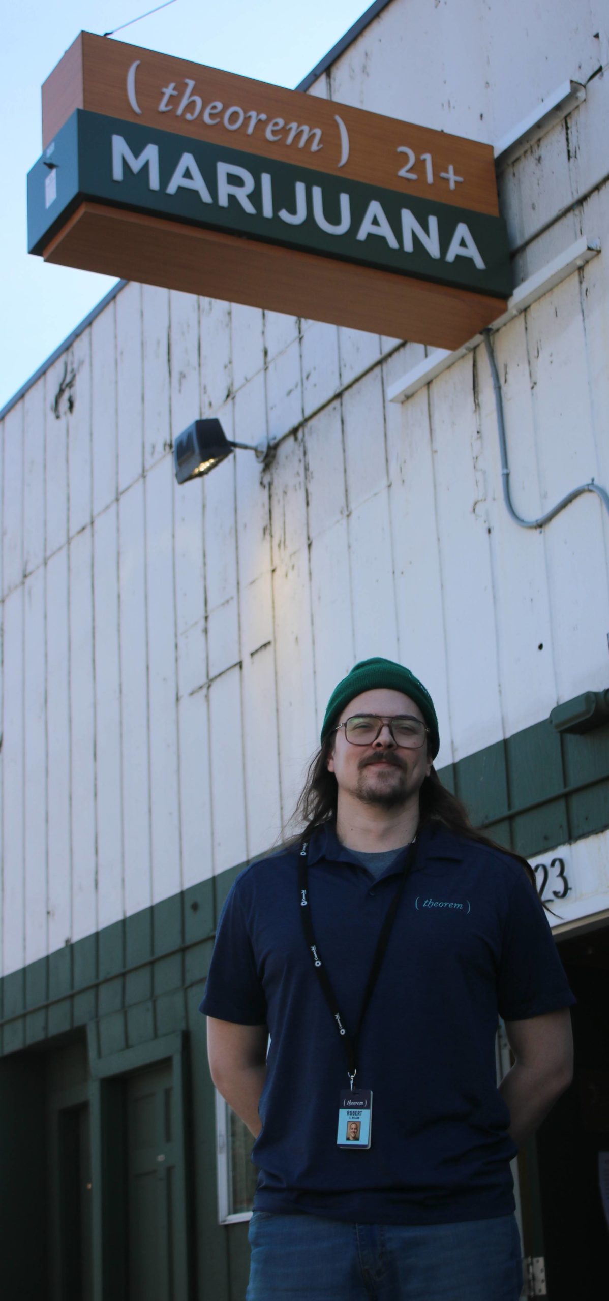 Theorem Cannabis manager Bobby Wilson stands in front of the Kenmore shop on March 19. Andy Nystrom/staff photo