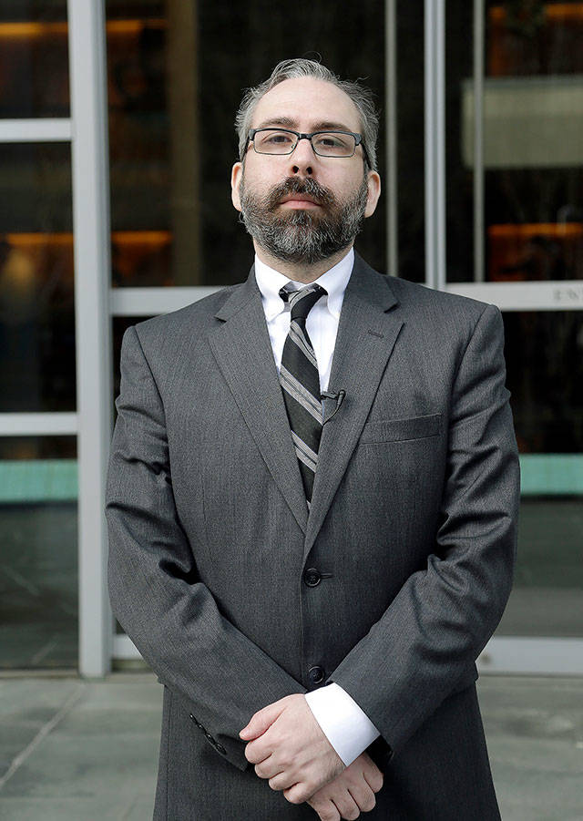 Democratic presidential elector Bret Chiafalo stands outside the U.S. Courthouse in Seattle before a hearing in December 2016. (AP Photo/Elaine Thompson, file)