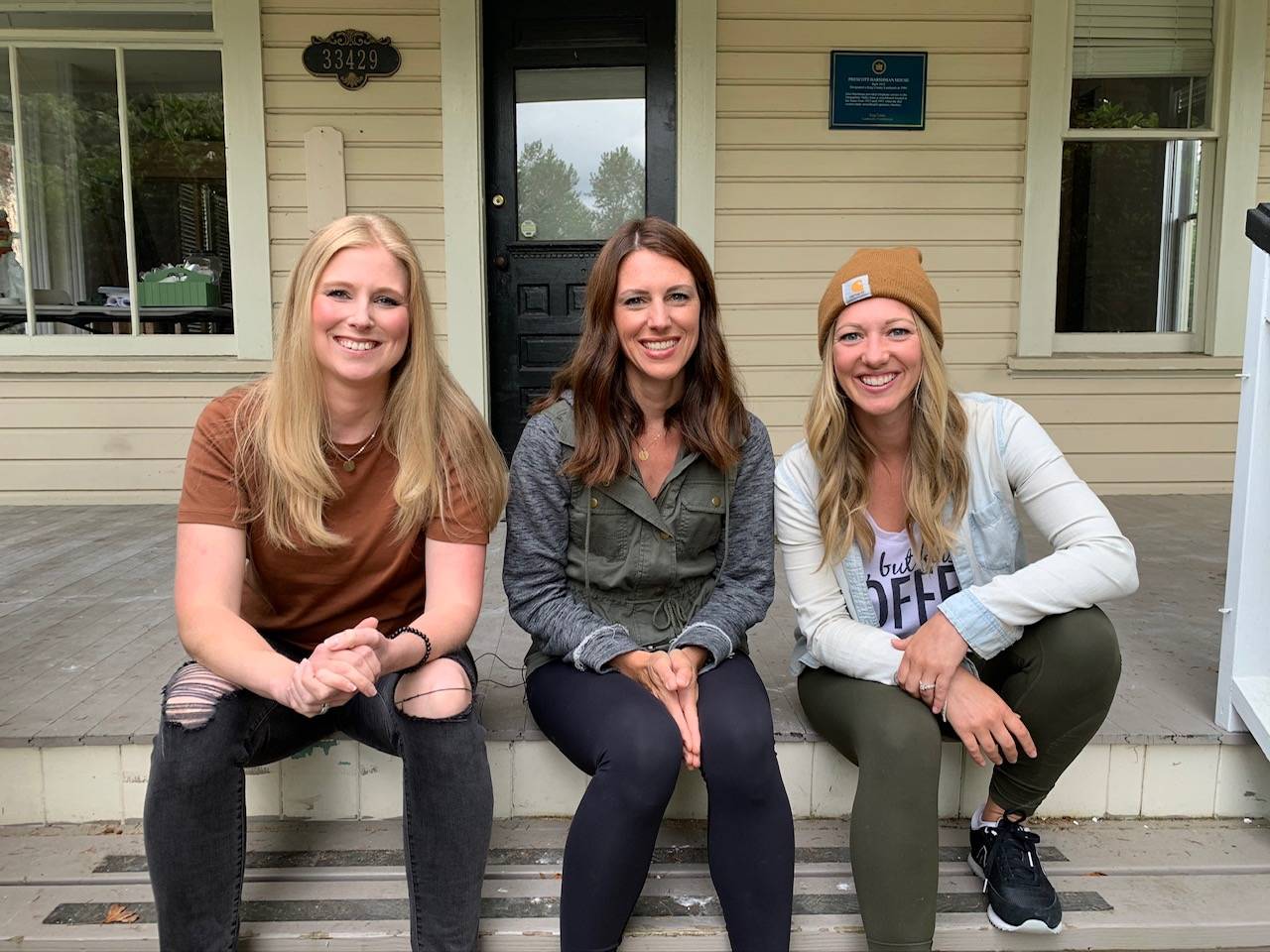 The co-founders of Aroma Coffee sit on the porch of their new coffee shop. From left to right: Kelsey Wilson, Sara Cox and Emily Ridout. Contributed by Emily Ridout.