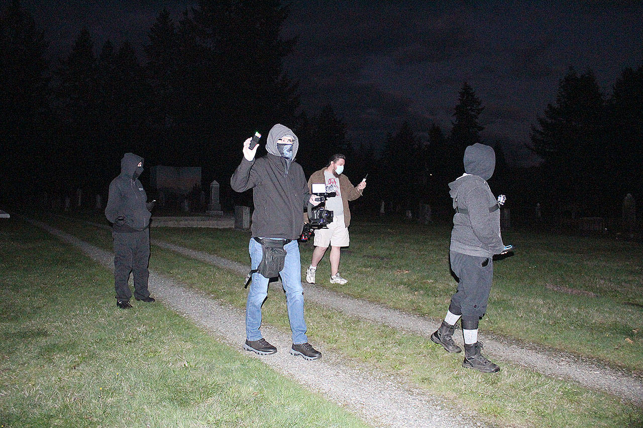 The first part of Cascadia Paranormal Investigation’s exploration of the Black Diamond Cemetery involved trying to find all the non-paranormal explanations for the phenomenon some people have reported at the site before sitting down with their arsenal of electronics to find any evidence of ghosts or spirits. Photos by Ray Miller-Still
