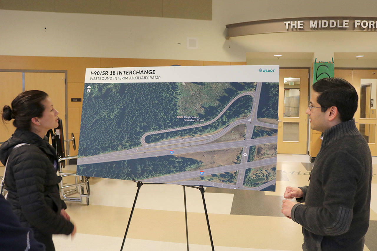 A WSDOT team member explains how the westbound interim auxiliary ramp will work to route traffic from the Snoqualmie Parkway on to I-90 in this file photo from a 2019 community meeting.