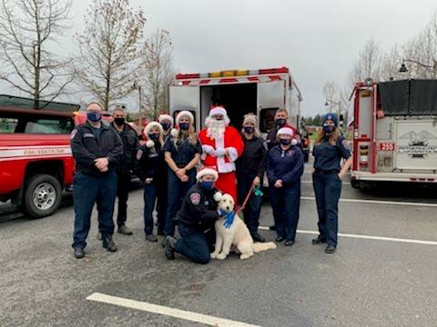 A photo of first resonders, the fire dog and Santa, who collected food donations for the Snoqualmie Valley Food Bank this month. Contributed by the city of Snoqualmie