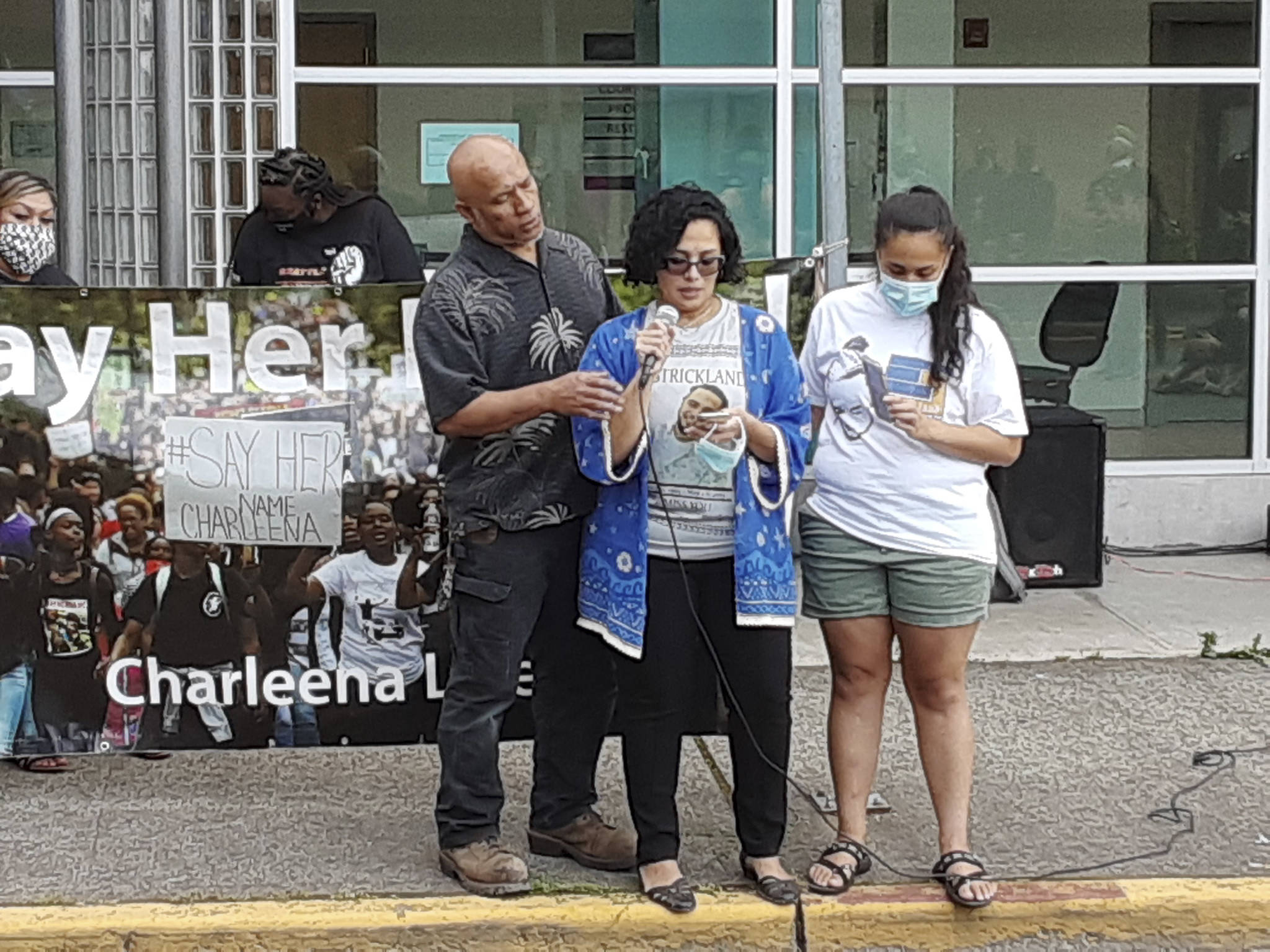 Backed by her family, Kathleen Strickland addresses the protest in front of the Auburn Justice Center on Aug. 6, 2020, and on behalf of her late son, Enos Strickland Jr., pleads for change at the Auburn Police Department. (Sound Publishing file photo)