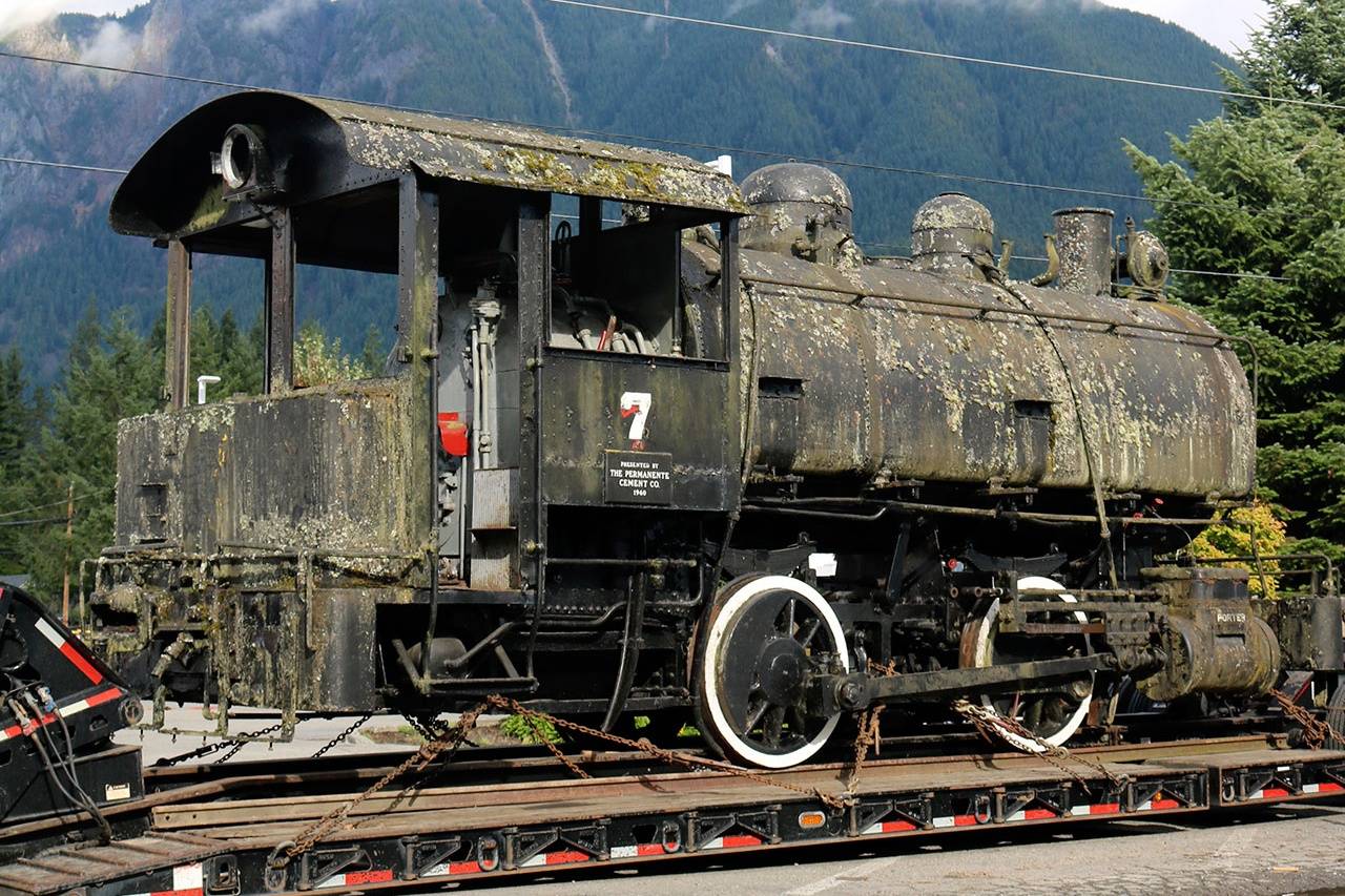 In this file photo, the No. 7 Porter arrives at the North Bend Depot as volunteers prepare to get it off of the truck and on to the rails. (Sound Publishing file photo)