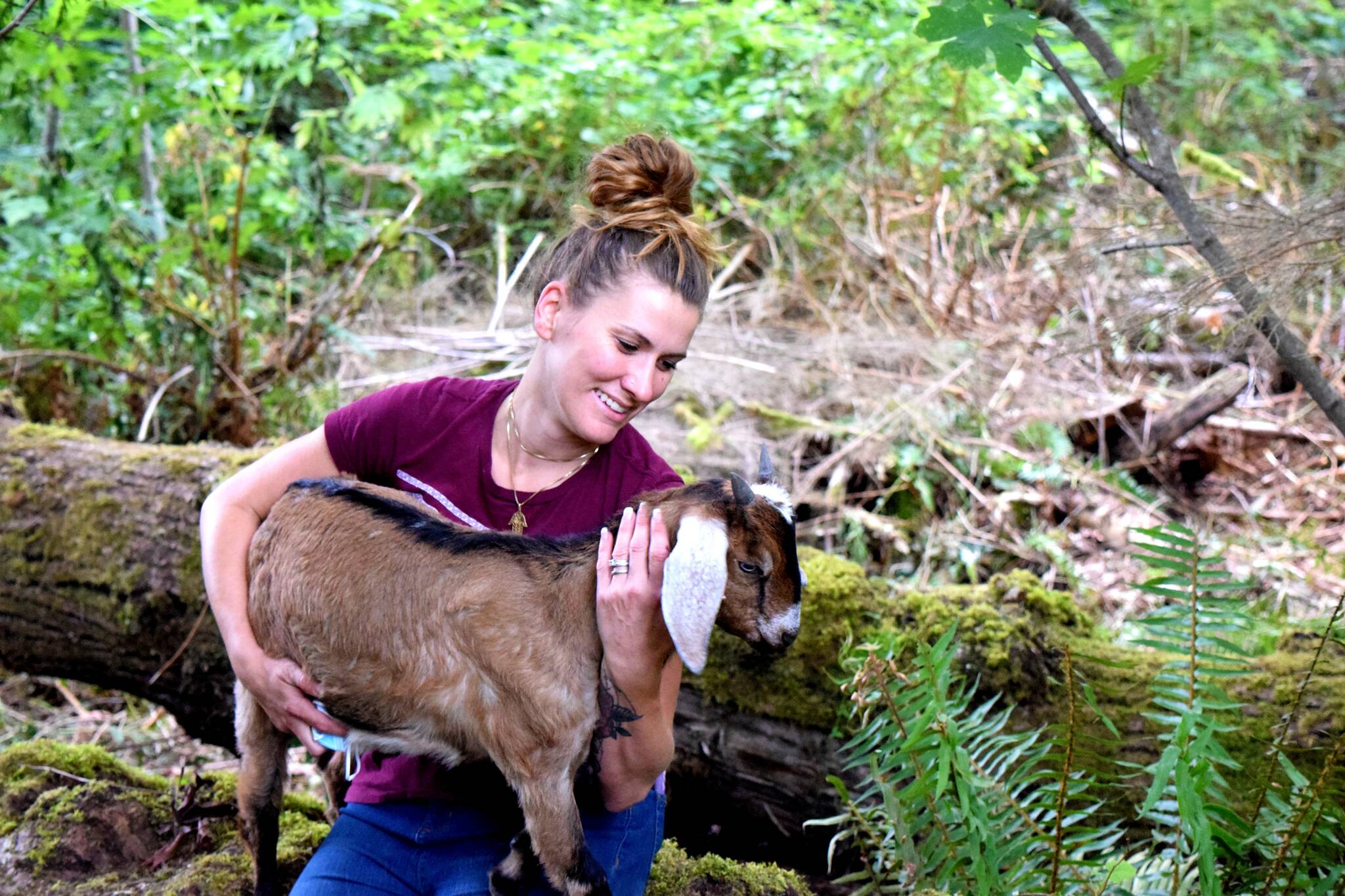 Christina Lathrop, owner of Fancy Farms Forest School in Fall City, poses with her goat. 	Photo Conor Wilson/Valley Record