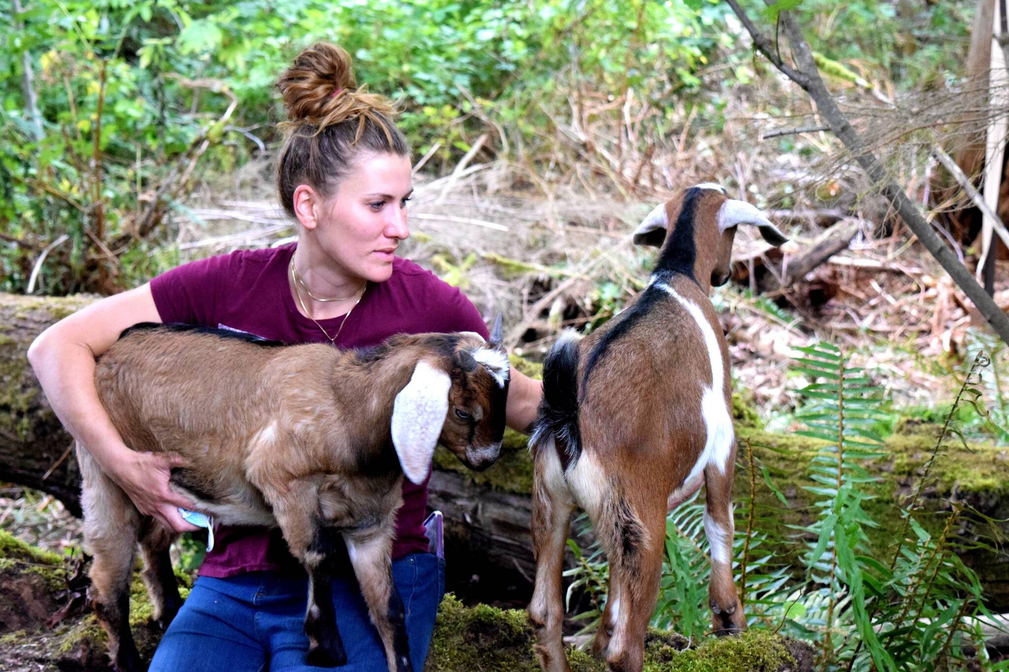 Christina Lathrop, owner of Fancy Farms Forest School in Fall City, poses with her goats. Photo Conor Wilson/Valley Record.