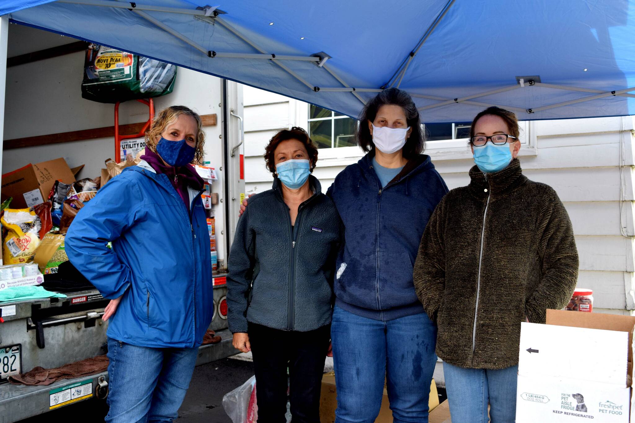 Snoqualmie Pet Food Bank volunteers (from left) Michelle, Kathy, Andrea and Marie. Photo by Conor Wilson/Valley Record