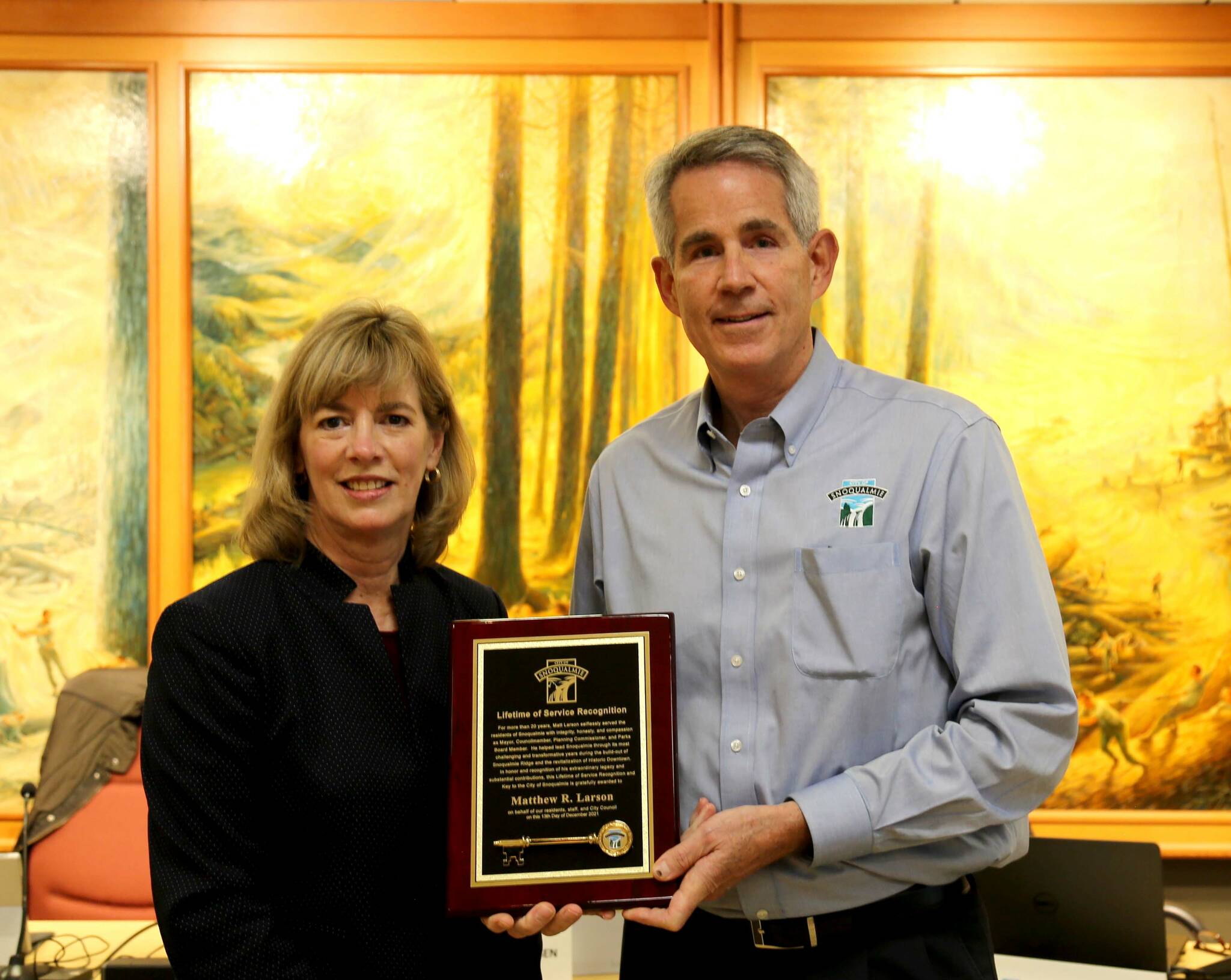 Courtesy photo
Snoqualmie Mayor Matt Larson (right) receives a lifetime service award and key to the city from Councilmember and Mayor-elect Katherine Ross on Dec. 13.