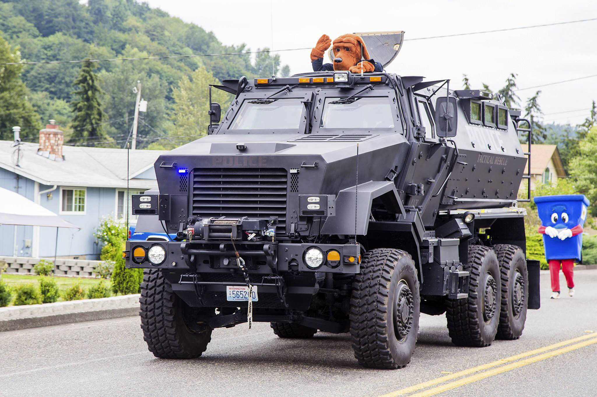 Snoqualmie Police Department houses a surplus military mine-resistant armored personnel carrier. It is seen here during a 2016 parade in Algona. Courtesy photo.