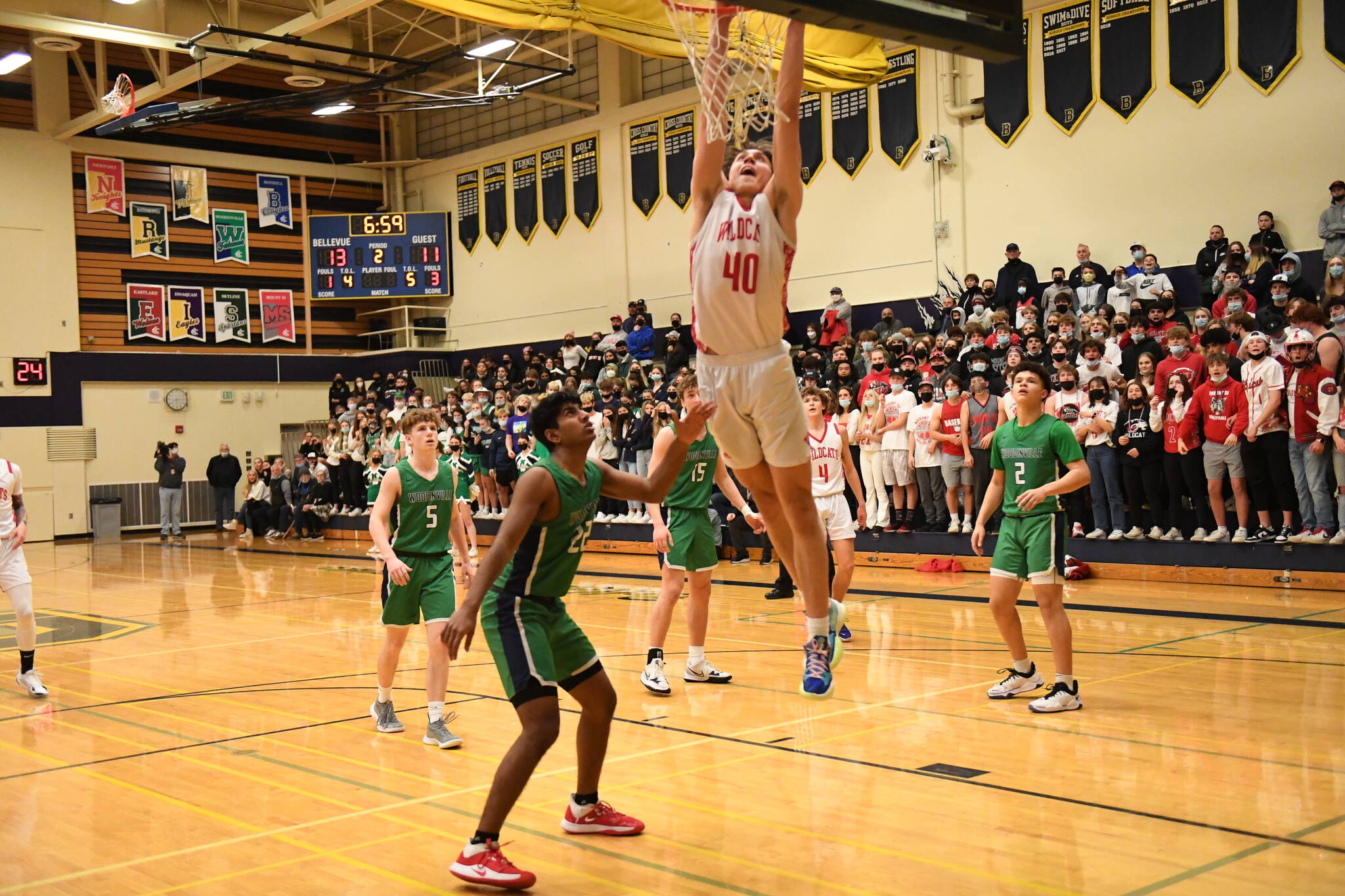 Photo Courtesy of Calder Productions
Senior forward Miles Heide goes for a dunk in the KingCo Championship game against Woodinville on Feb. 5. The Wildcats beat the Falcons, 72-42, and were crowned league champions. They will be the top seed in the KingCo/WesCO district tournament.