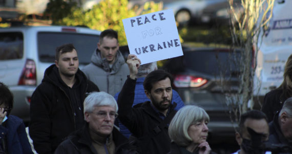 Igor Soloydenko, who said he identifies as Russian, holds a sign urging “Peace for Ukraine” at a ceremony Feb. 25 in Federal Way. Soloydenko said: “There’s just so much shame. I feel helpless in the way I cannot change anything in my home country. It was unimaginable that Russia would do such a thing.” Olivia Sullivan/Sound Publishing