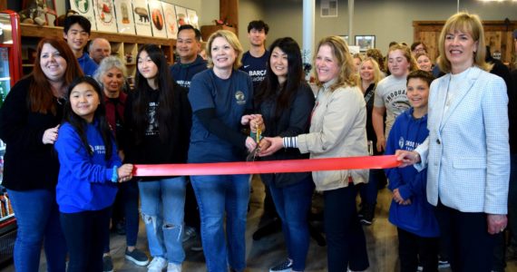Snoqualmie Trading Co. owners, Heather Dean, Julie Chung and Cheri Buell (center), celebrate the grand opening of their new shop with SnoValley Chamber of Commerce Executive Director Kelly Coughlin (left) and Snoqualmie Mayor Katherine Ross (right) on March 18.