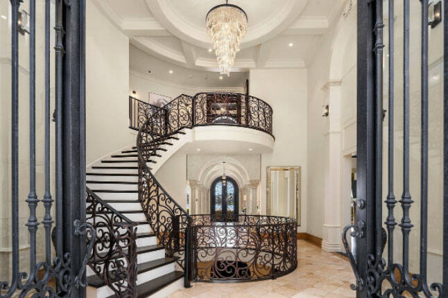 The center of the home features a massive spiraling staircase (Screenshot from Redfin website)