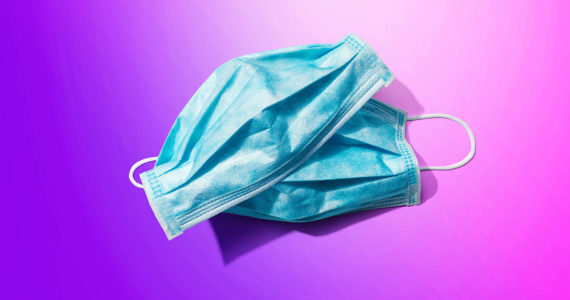 Blue surgical masks overhead view (Adobe stock image)