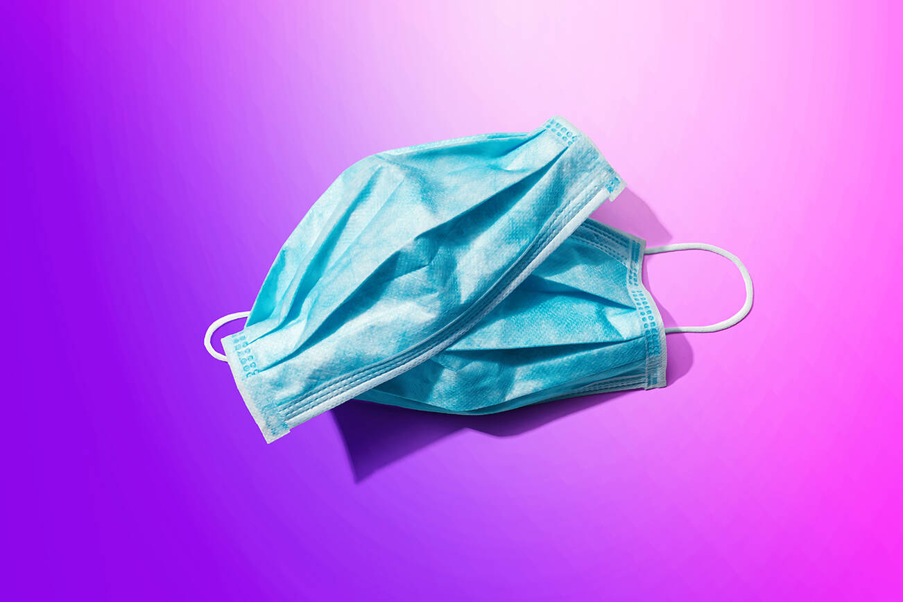 Blue surgical masks overhead view (Adobe stock image)