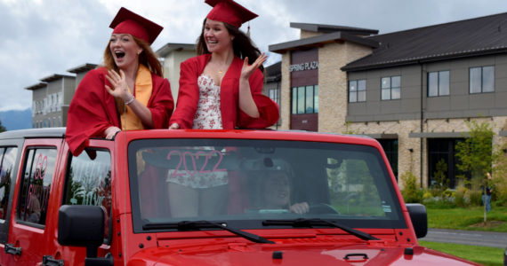 Mount Si High School seniors wave to parade watchers during during the Senior Car Parade on Saturday, June 4. The class of 2022 will hold its graduation Friday, June 10, at the ShoWare Center in Kent. Photo by Conor Wilson/Valley Record.