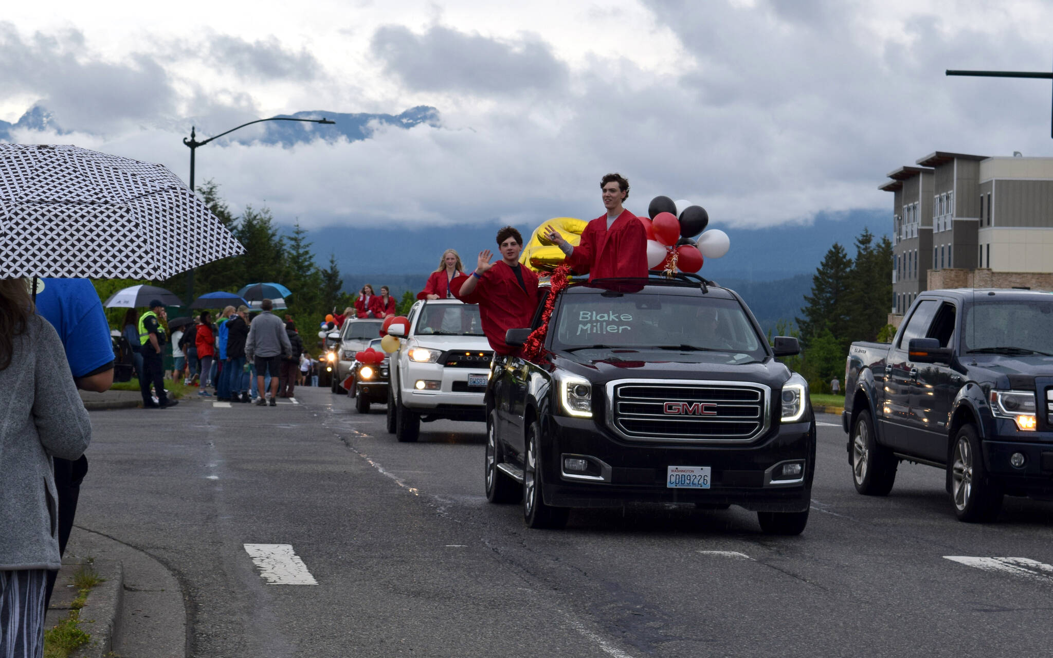 Cars drive along the Snoqualmie Parkway during the Mount Si High School Senior Car Parade on June 4. Photo Conor Wilson/Valley Record.