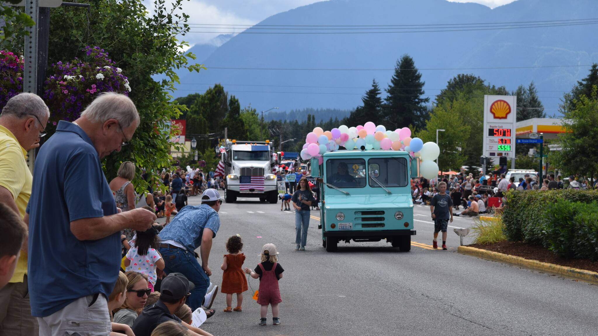 The crowd at Festival at Mt. Si watch an ice cream truck approach during the Grand Parade. Photo Conor Wilson/Valley Record.