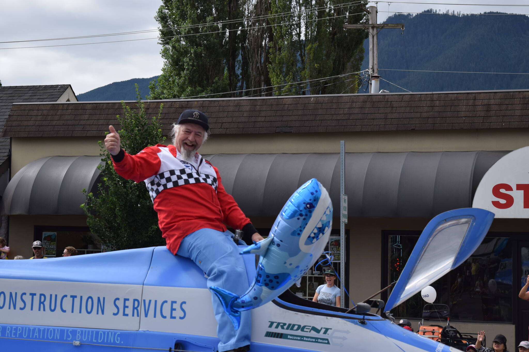 A man gives a thumbs up to the crowd during the Festival at Mt. Si Parade. Photo Conor Wilson/Valley Record.