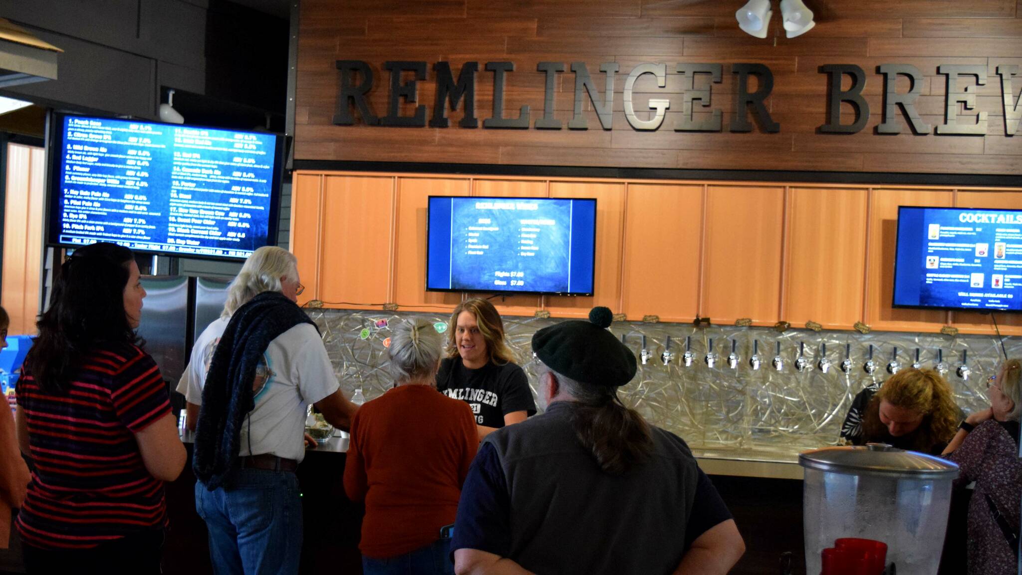 Patrons line up for drinks at Remlinger Farms new brewery. Photo Conor Wilson/Valley Record.