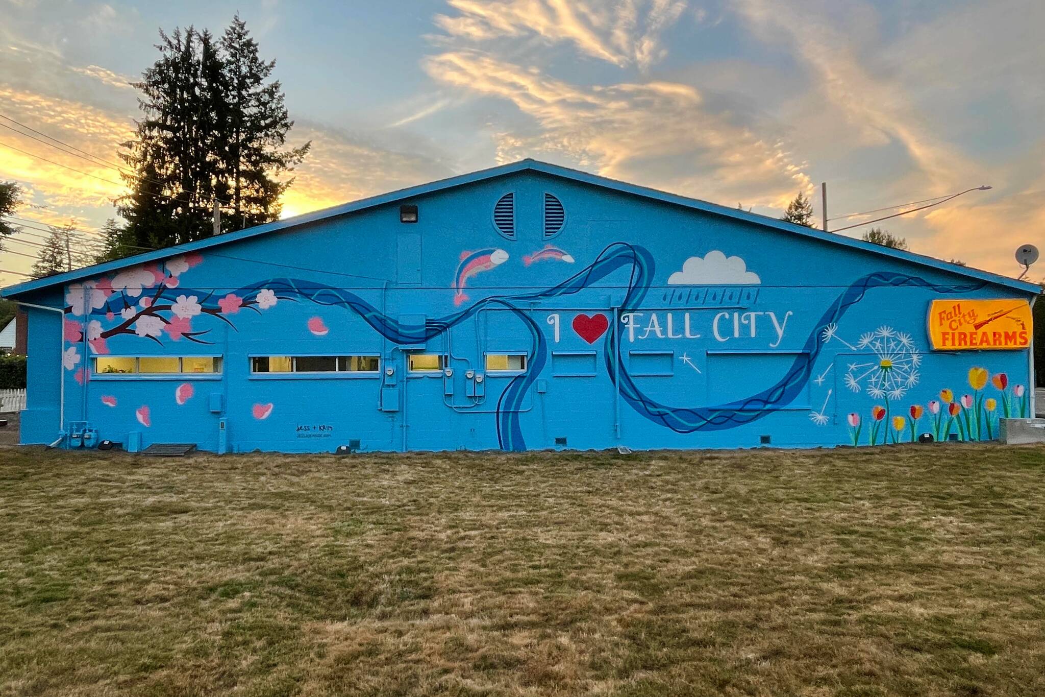 Photo courtesy of Krimsey Lilleth.
A newly painted mural on the Fall City Firearms building at sunset.