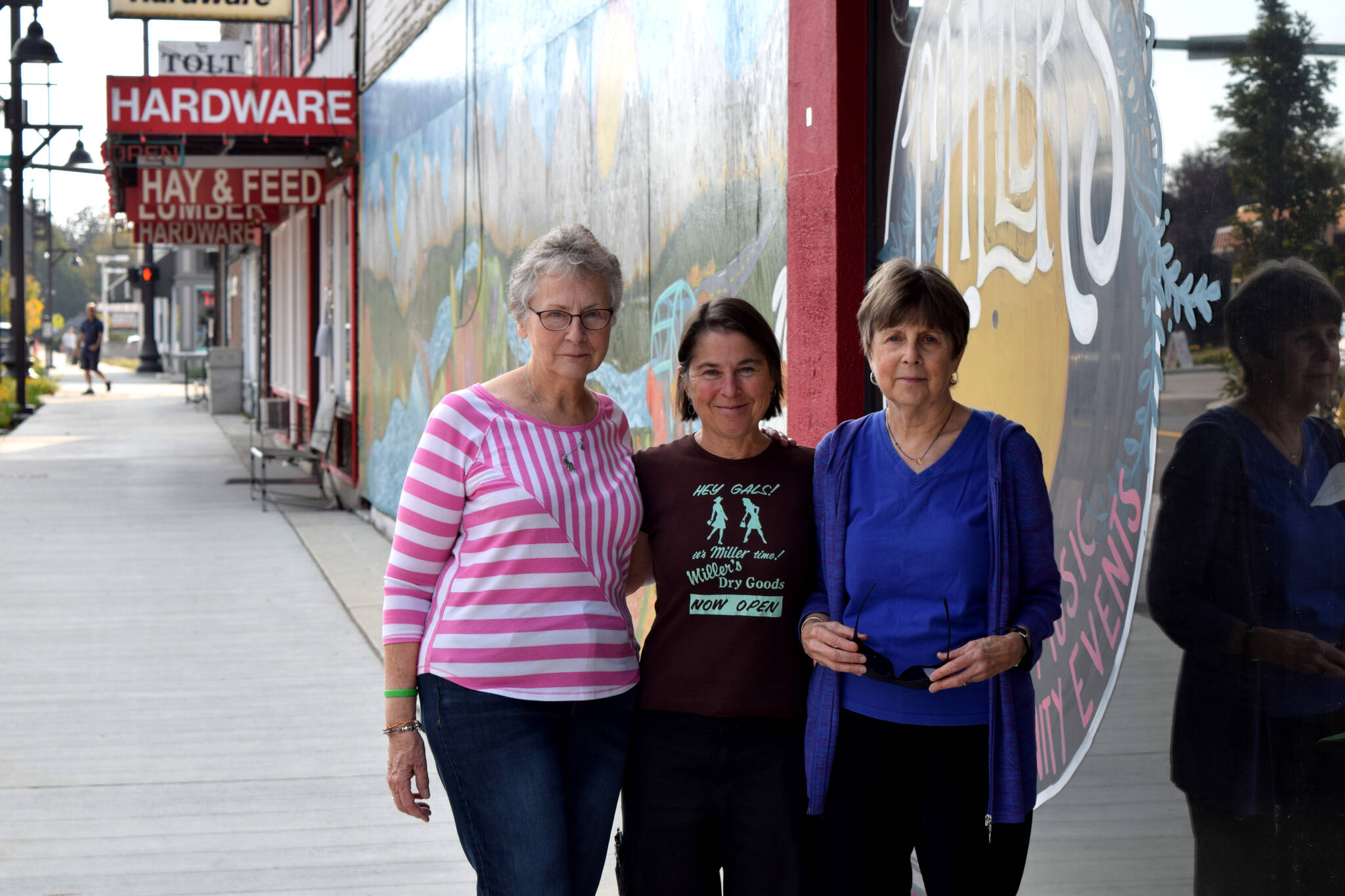 Jules Hughes, center, stands with Jackie Norris (l) and Kris Kirby outside Millers in Carnation. Photo by Conor Wilson/Valley Record
