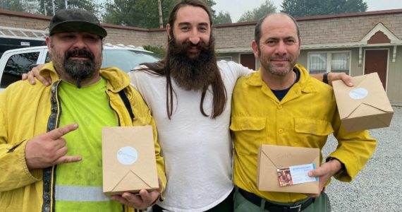 Three firefighters from Methow Valley supporting wildfire fighting efforts outside Snoqualmie receive lunch from Snoqualmie Casino employees. Photo courtesy of Tarah Smigun.