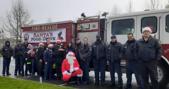 The Snoqualmie Fire and Police Department participated in the second annual Santa Parade and Food Drive to benefit the Helping Hands Ministry Backpack Program. The group provided food for over 200 kids who face food insecurity and provided gifts to 262 kids in the Valley. Courtesy Photo