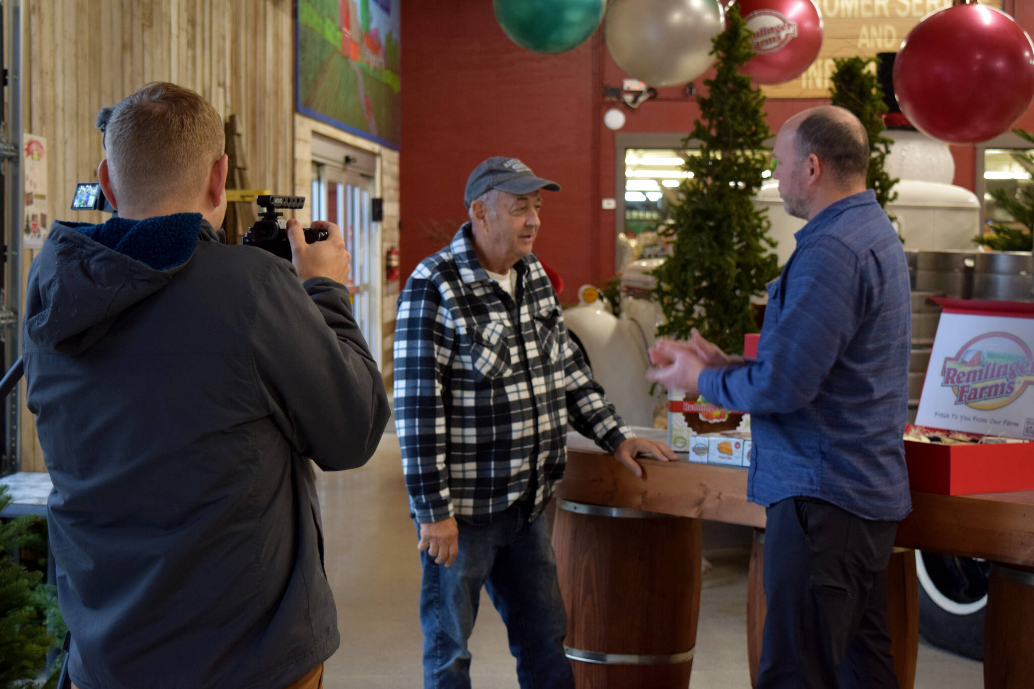 Brian Davis chats with Gary Remlinger, of Remlinger Farms in Carnation.