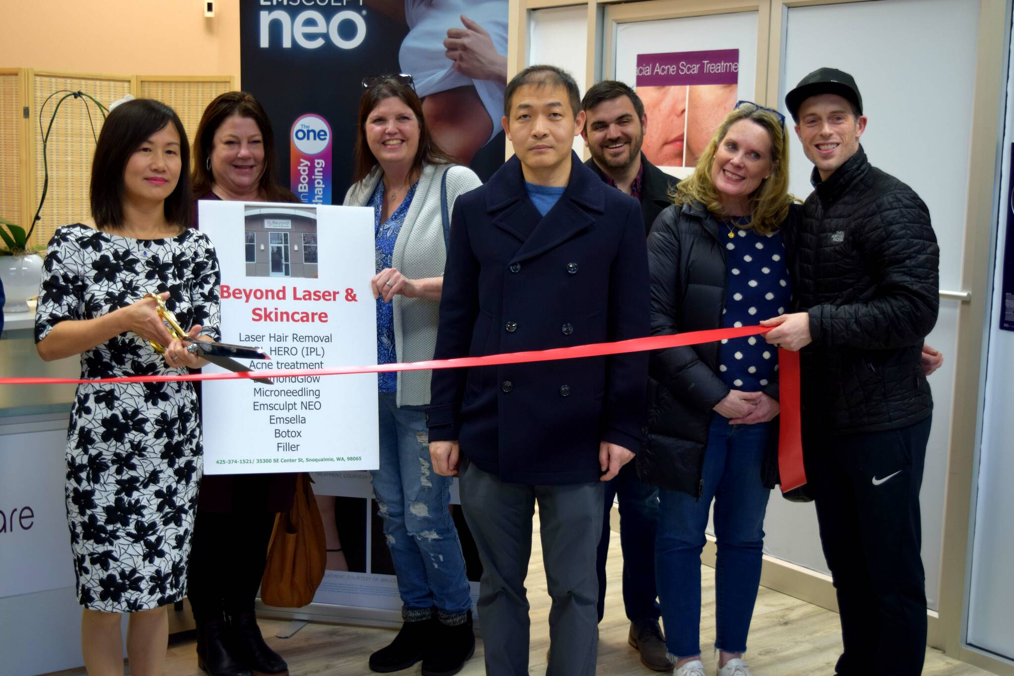 Biwei Dong (left), owner of Beyond Laser & Skin Care, and her husband are joined by members of the SnoValley Chamber of Commerce, Downtown Merchants Association and City of Snoqualmie in celebrating the opening and one-year anniversary of her business on Jan. 19. Photo Conor Wilson/Valley Record.