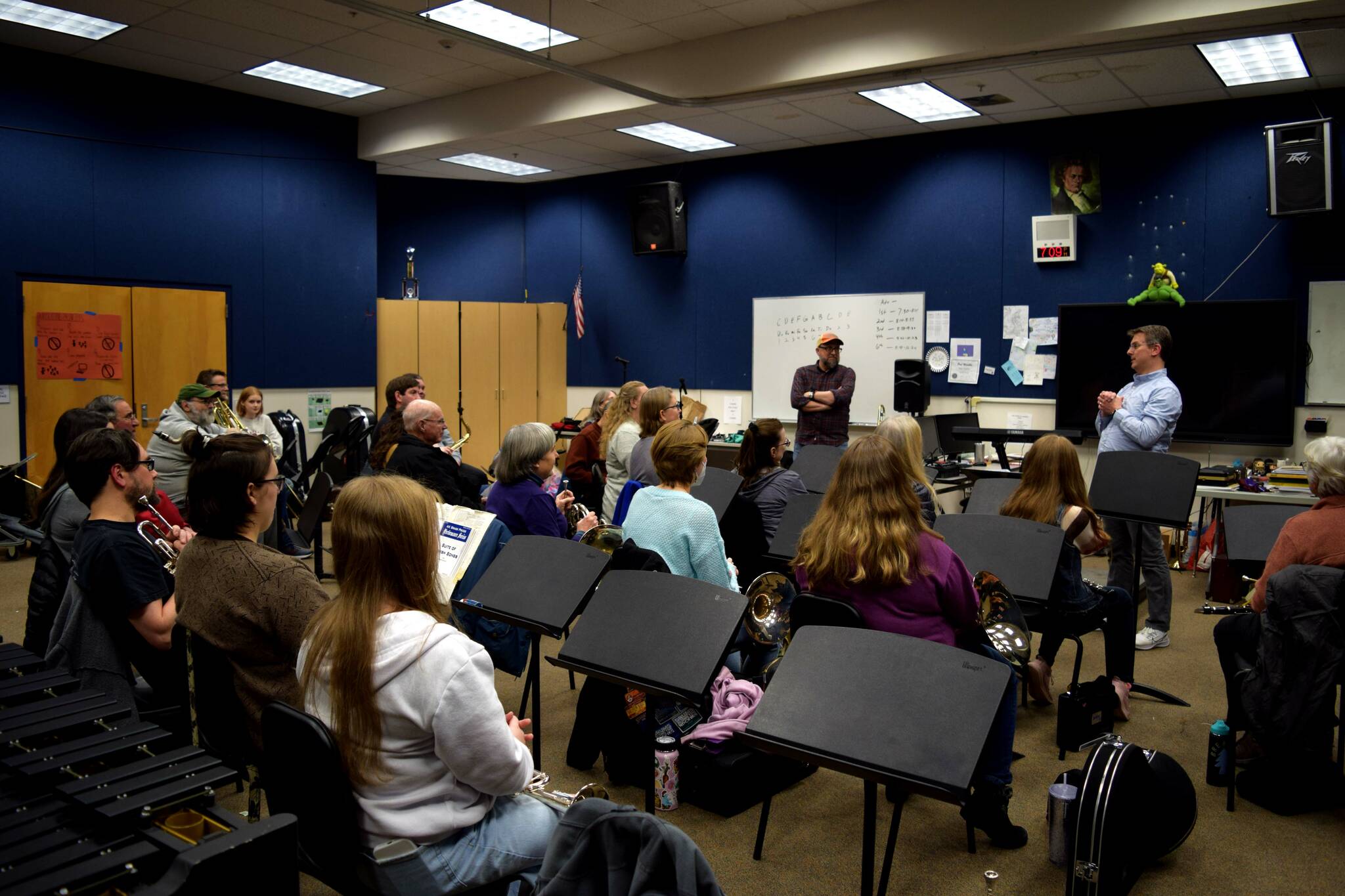 Photo by Conor Wilson/Valley Record.
Band Director Mike Herb and Dean Snavely speak to members of the SnoValley Winds band before its first rehearsal.