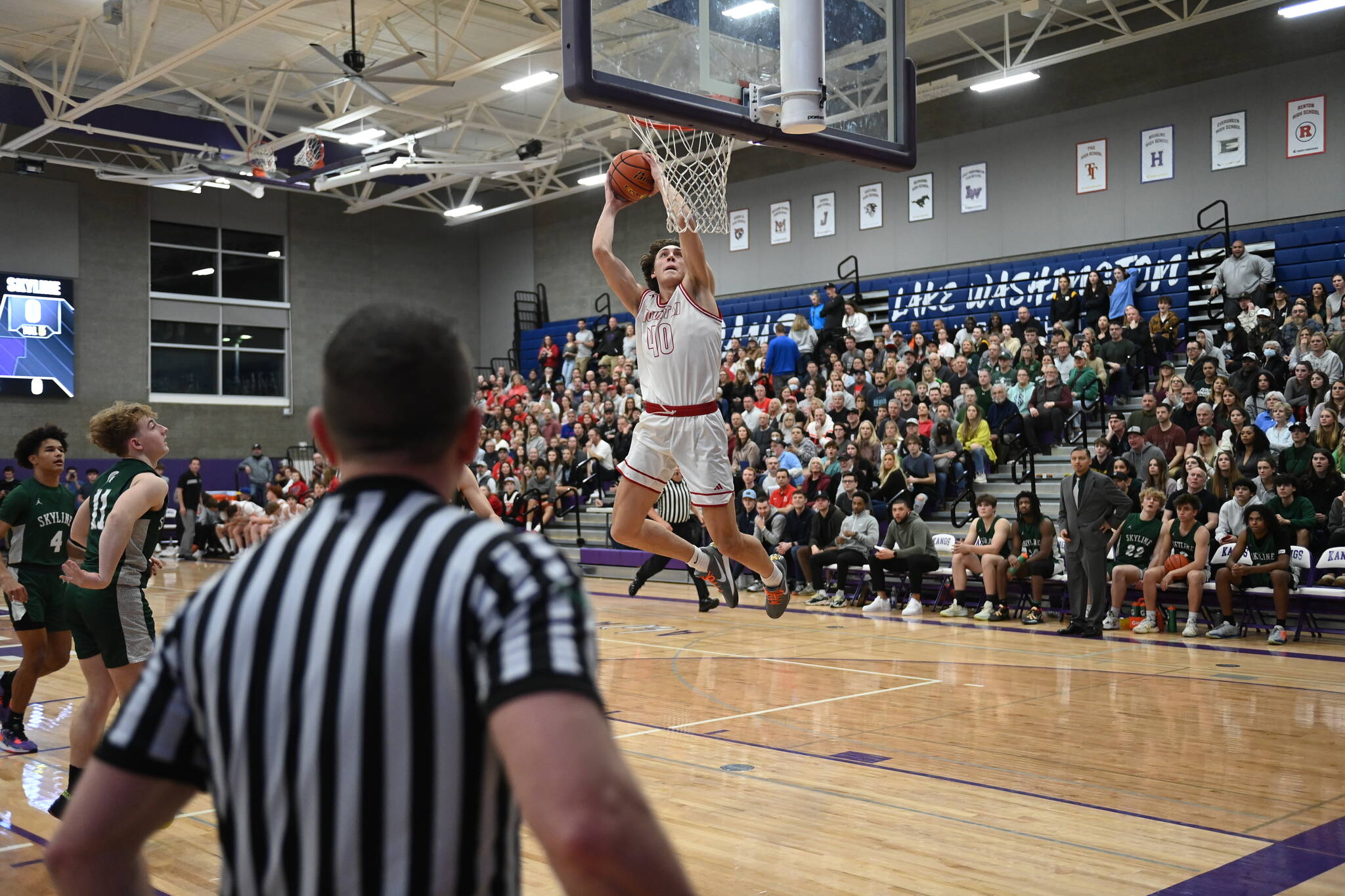 Mount Si Senior Miles Heide dunks the ball in the KingCo League championship game against Skyline on Feb. 4. Photo courtesy of Calder Productions.