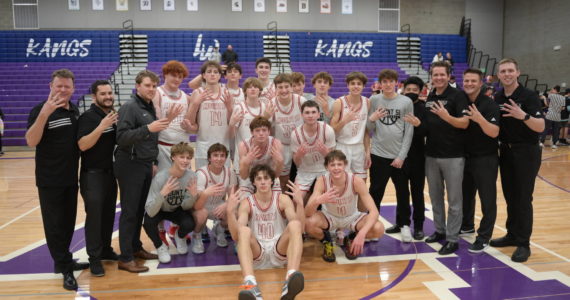 The Mount Si Boys Basketball team celebrates winning the KingCo League title on Feb. 4 at Lake Washington High School. Photo courtesy of Calder Productions.