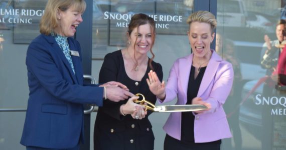 Hospital CEO Renee Jensen (middle), stands with Snoqualmie Mayor Katherine Ross (left) and Dr. Tammy Moore, during a ribbon cutting ceremony outside the Snoqualmie Ridge Medical Clinic on Feb. 8. Photo Conor Wilson/Valley Record.