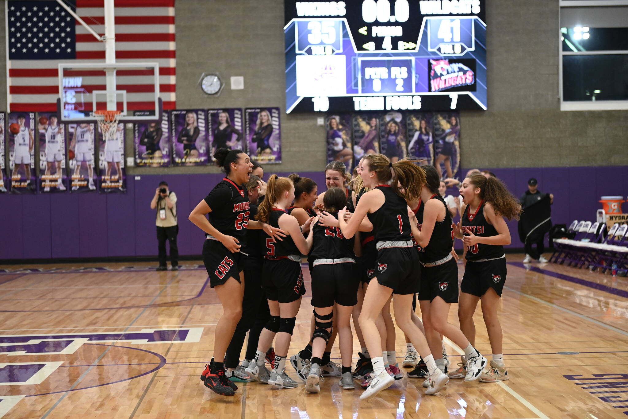 The Mount Si Girls basketball team celebrate after victory over Lake Stevens on Feb. 16 sends them to the state tournament. It will be their first appearance at state in nearly 30 years. Photo courtesy of Calder Productions.
