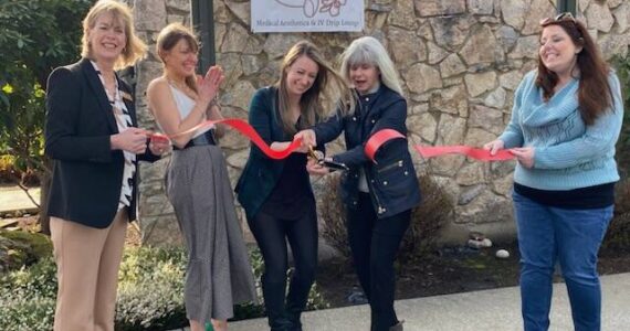 Dr. Erika Peschel (center), owner of Alpenglow Aesthetique, holds a ribbon cutting ceremony for her new business on March 16. She is joined by SnoValley Chamber CEO Kelly Coughlin (right) and Snoqualmie Mayor Katherine Ross (left). Alpenglow Aesthetique is located near Downtown Snoqualmie at 38700 Southeast River Street, Suite 300. Photo William Shaw/Valley Record.