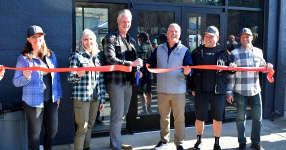 Owners of The Line Bike Experience at their grand opening on March 18. From left: Alex Kunz, Sheryl Tullis, Michael Kunz, North Bend Mayor Rob McFarland, Steve Tullis and James Skinner. Photos by Conor Wilson/Valley Record