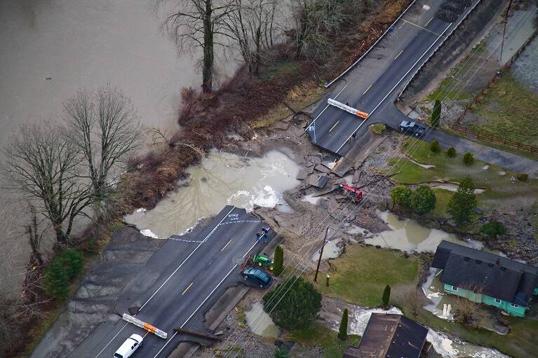 Crews assess the damage to State Route 202 during the 2009 Snoqualmie River flood. Photo courtesy of King County Department of Natural Resources.
