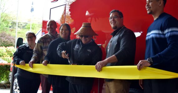 Snoqualmie Tribal Chairmen Robert de los Angeles (center) cuts a ribbon to celebrate the new emergency aid vehicle alongside members of the Snoqualmie Tribal Council.  From left: Shauna Shipp-Martinez, Christopher Castleberry, Melynda Digre, Robert de los Angeles, Steve de los Angeles, David Maddock.  All photos Conor Wilson and William Shaw/Valley Record.