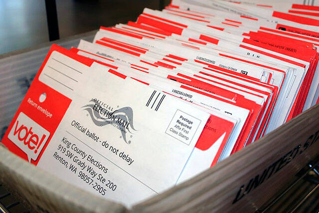 A stack of sealed voter ballots wait to be counted by King County Officials. File photo.