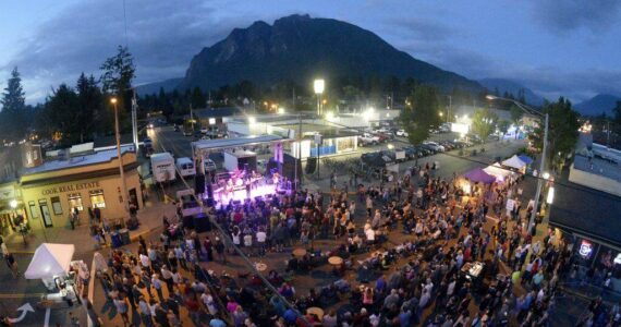 A crowd forms at the Main Stage for a concert at the North Bend Downtown Block Party in 2016. File photo.